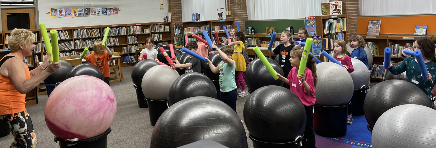 Parkview Elementary students learning from an exercise instructor on career day