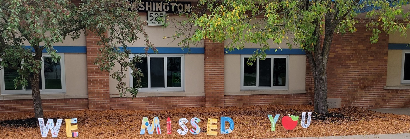 Washington school with "we missed you" sign