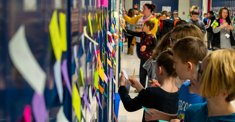 Positive Post-it day hallway