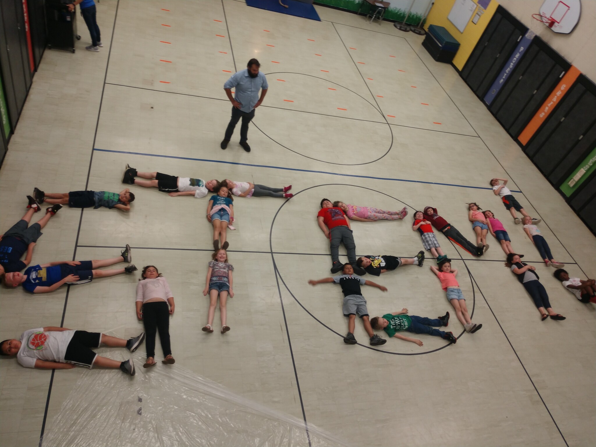 Students use their bodies to spell out S.T.E.M.