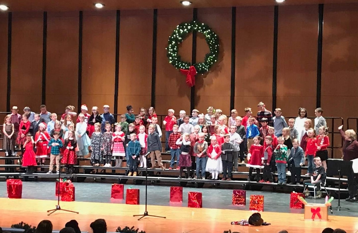 Students on stage for first grade music program 2019
