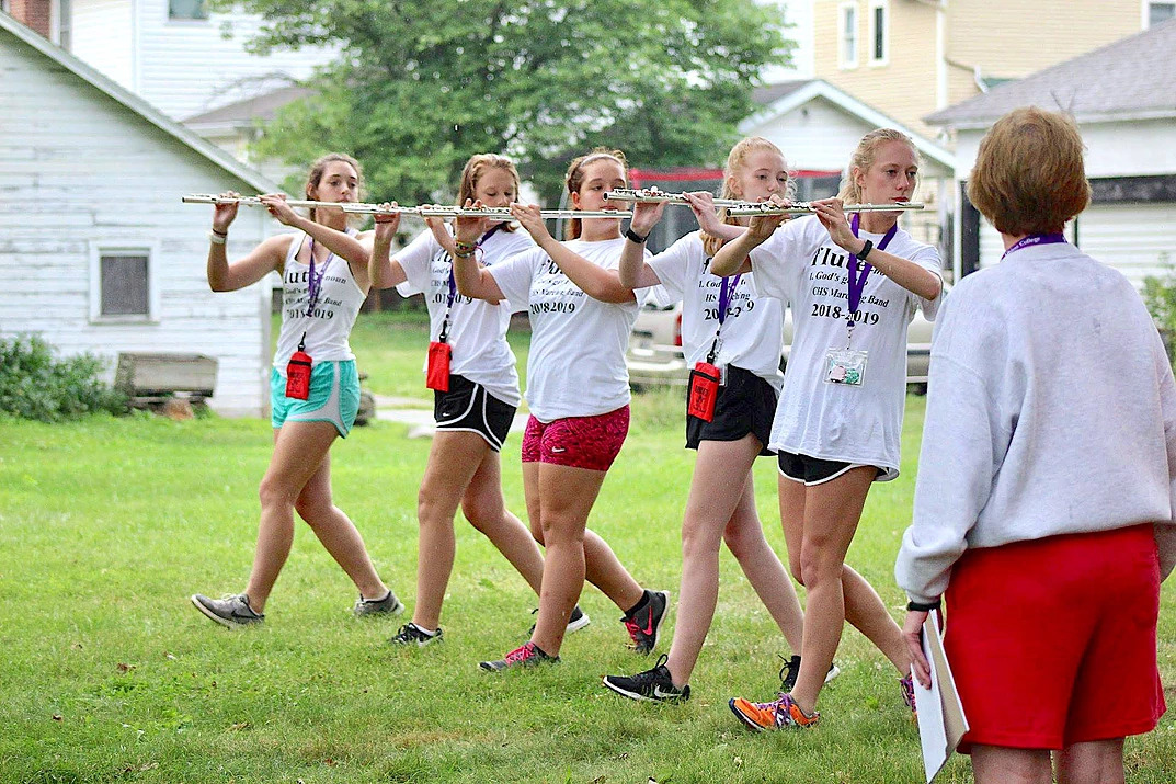 Flutes practicing marching