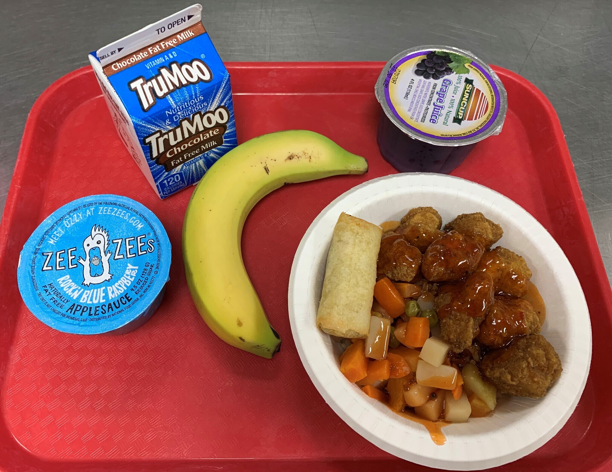 "Oriole" bowl with sweet and sour chicken, rice , veggies, sauce and an egg roll. Served with fruit, juice and milk. Good Lunch!!!