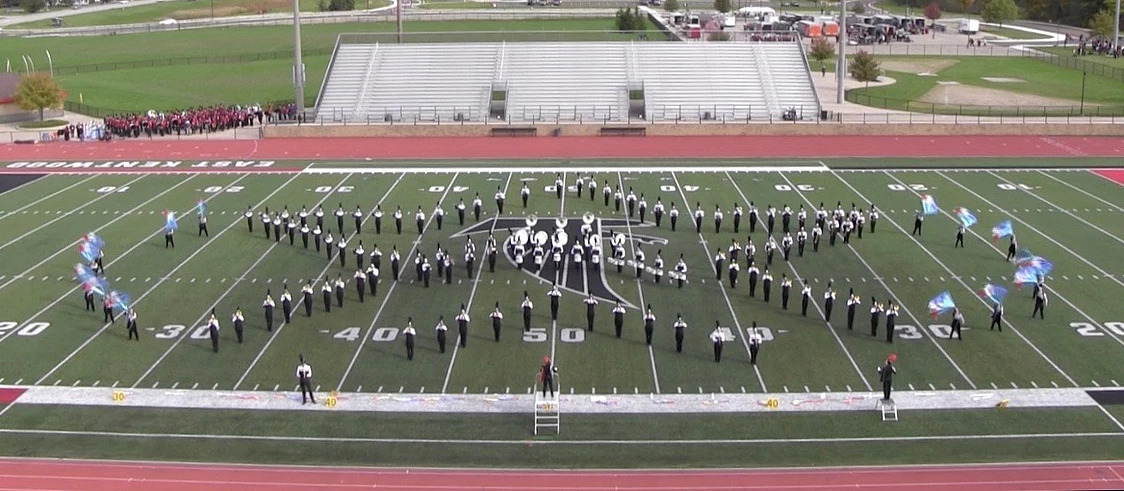 Marching band on field - star formation