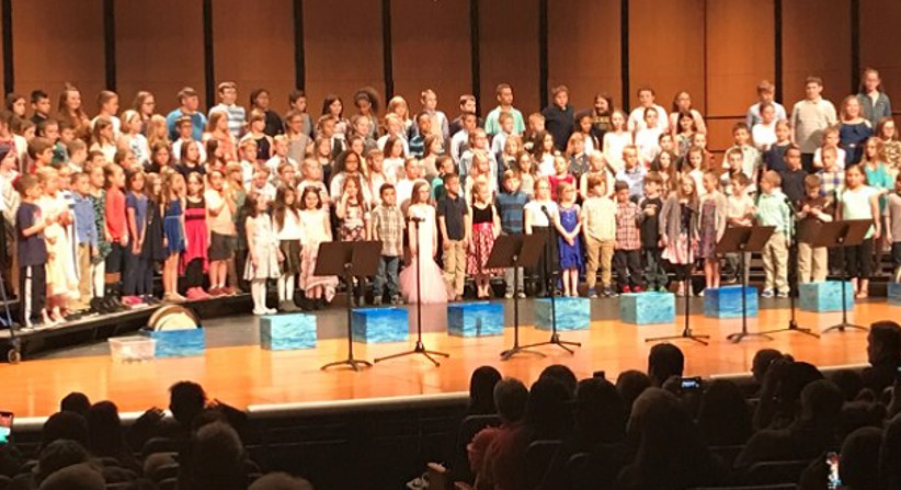 Students on stage for third grade music program 2019