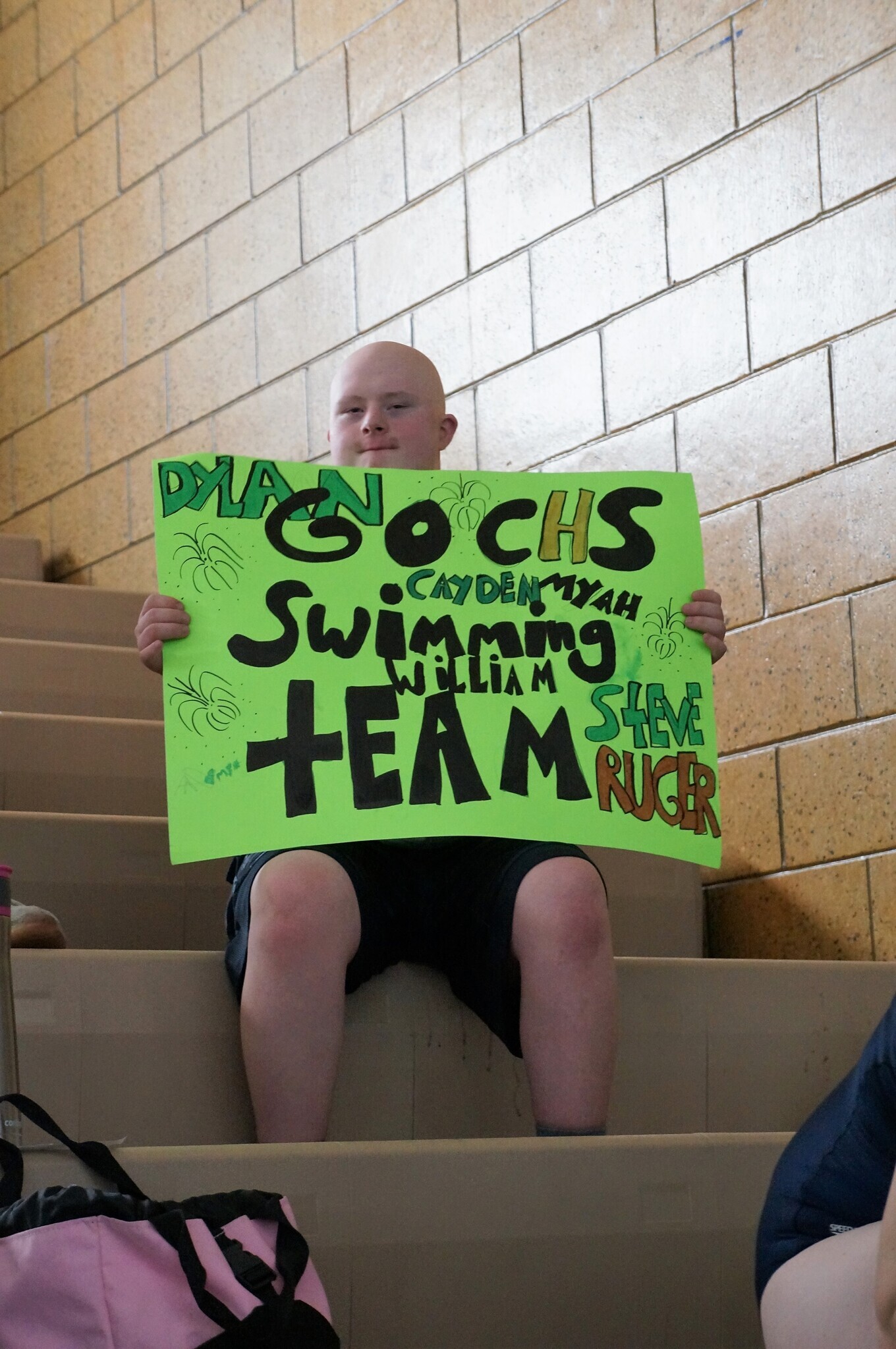 Fans cheer for Special Olympics swimmers