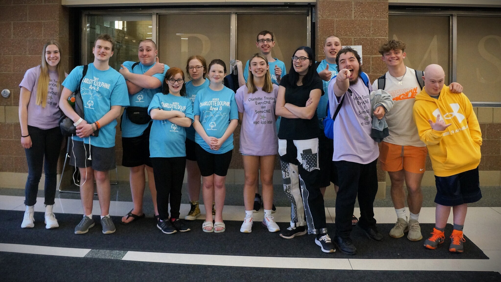 Special Olympics students post at the pool